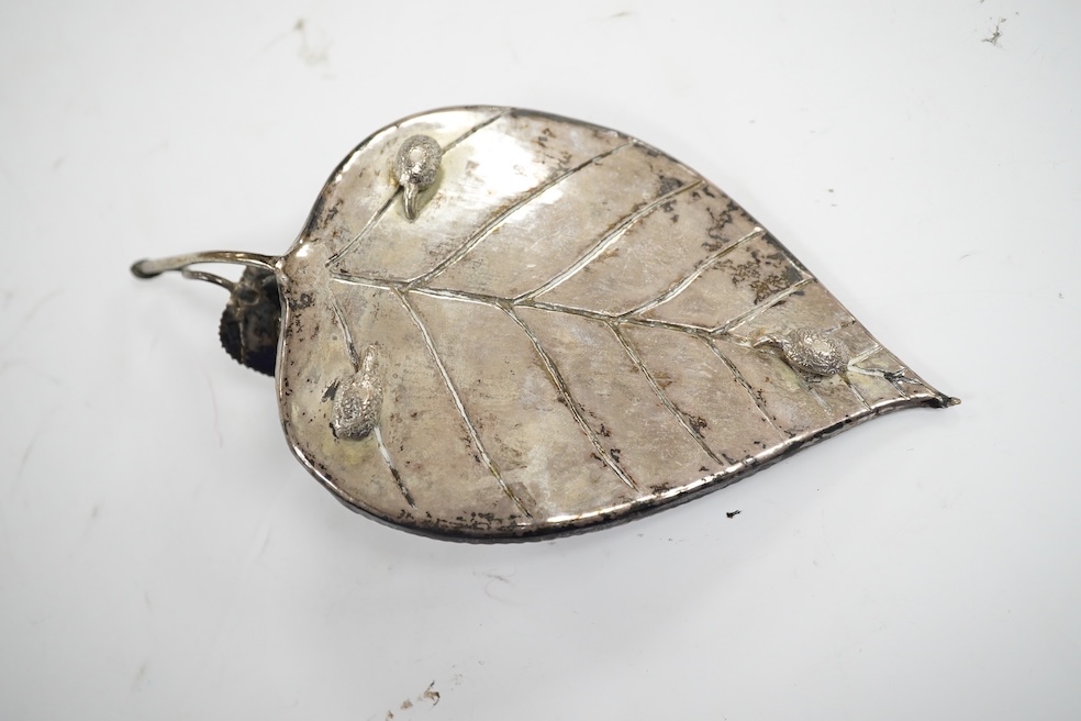 A Chinese white metal leaf dish, 16.4cm, two other Chinese items including a spirit lock and a Japanese white metal frame by Murai Shokai. Condition - poor to fair.